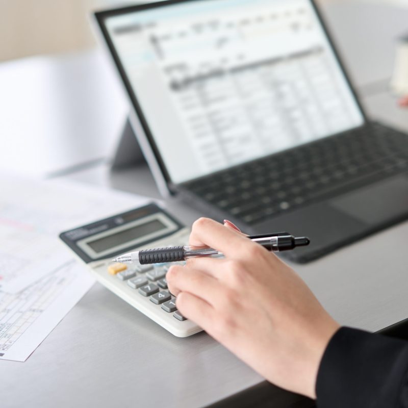 asian-woman-using-accounting-software-and-calculat-2023-11-27-04-54-34-utc